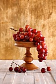 Red grapes on a wooden stand