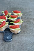 Crostini topped with chevre cheese, avocado and grapefruit