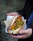 Hot dog with jalapeno, mustard and ketchup from the food truck