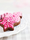 Chocolate Christmas biscuits with pink icing