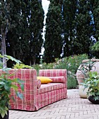 Tartan sofa on Mediterranean terrace