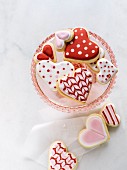 Valentine's heart shaped cookies on pink pedestal