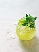 A cocktail with lime and mint