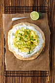 Meringue with coconut cream, pineapple and lime