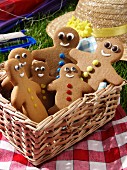 Gingerbread men in a basket at a grassy picnic