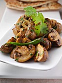 A dish of Kukor mutta spicy mushrooms editorial food