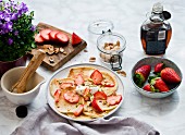 Pancakes with strawberries and pistachios