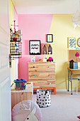 Wall painted yellow and pink in child's bedroom