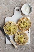 Individual apple tarts with pistachio nuts, view from above