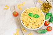 Farfalle pasta with basil, tomatoes and olive oil