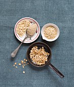 Oats in little bowls and a pan