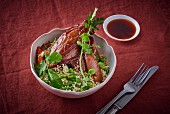 Leg of lamb with couscous and peas