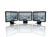 Three computer monitors