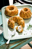 Savoury ring cakes with yoghurt and thyme on a tray