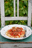Pasta (tagliatelle) with tomato sauce and wild mushrooms (milk caps)