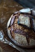 A loaf of dark sourdough bread