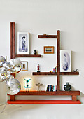 Ornaments on angular shelving made from wooden beams