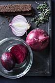 Ingredients for beetroot and apple soup with onions, cress and pumpernickel bread