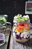 Couscous salad with red cabbage, yoghurt, lettuce hearts, carrot, tomato, cucumber, mozzarella and parsley