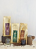 Various coffee blends and a hand grinder from 'Supremo'
