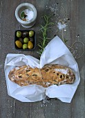Olive bread wrapped in paper