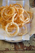 Fried onion rings on a rustic table
