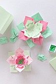 Origami flowers made from paper of various colours and beads