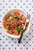 Tomato salad with green asparagus and anchovies