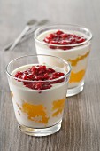 Yoghurt desserts with lemon curd and raspberry puree
