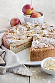 A summery nectarine cake made from quark oil dough and filled with vanilla pudding
