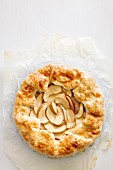 Galette with apples and cinnamon on parchment paper