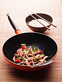 Chicken with peppers in a wok