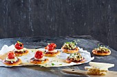 Mini pizzas with tomatoes and olives