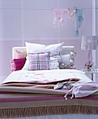 Various patterns in shades of pink in romantic bedroom
