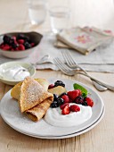 Pancakes with mixed berries and cream