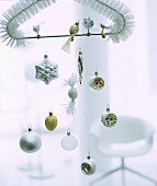 Christmas-tree baubles and birds hung from triangular brush head