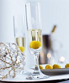 Mirabelle plum in glass of Prosecco