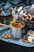 Vegan goulash soup with potatoes, carrots, paprika and soya strips