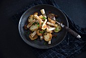 Fried potatoes with black salsifies and soya strips (vegan)