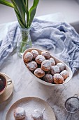 Castagnole, Italian sweet fritters in a white bowl