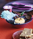 Goose liver pate on red cabbage leaves