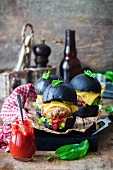 Black burgers with cheese and ketchup