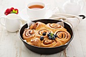 Cinnamon buns baked in a cast iron skillet