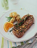 Grilled beef steak with herbs and new potatoes