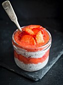 Chia pudding with red berries mousse and fresh strawberries