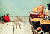 Breakfast with fresh Coffee, strawberry jam and croissants