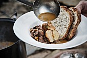 Meat stew with apples and bread (camping)