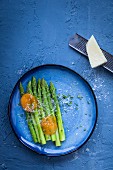 Green asparagus with pickled egg yolks and parmesan