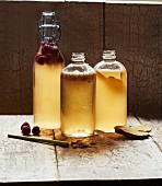 Homemade Kombucha tea with lemongrass, raspberries, and ginger in bottles