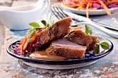 Roast goose breast with gravy and vegetables